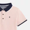Boy's pink cotton piqué polo shirt with short sleeves
